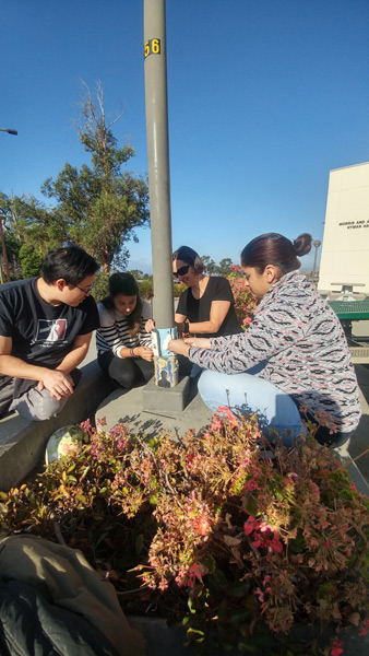 3_students-installing-totem-poles