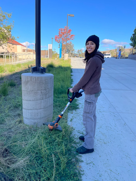 13_person-smiling-near-concrete-post